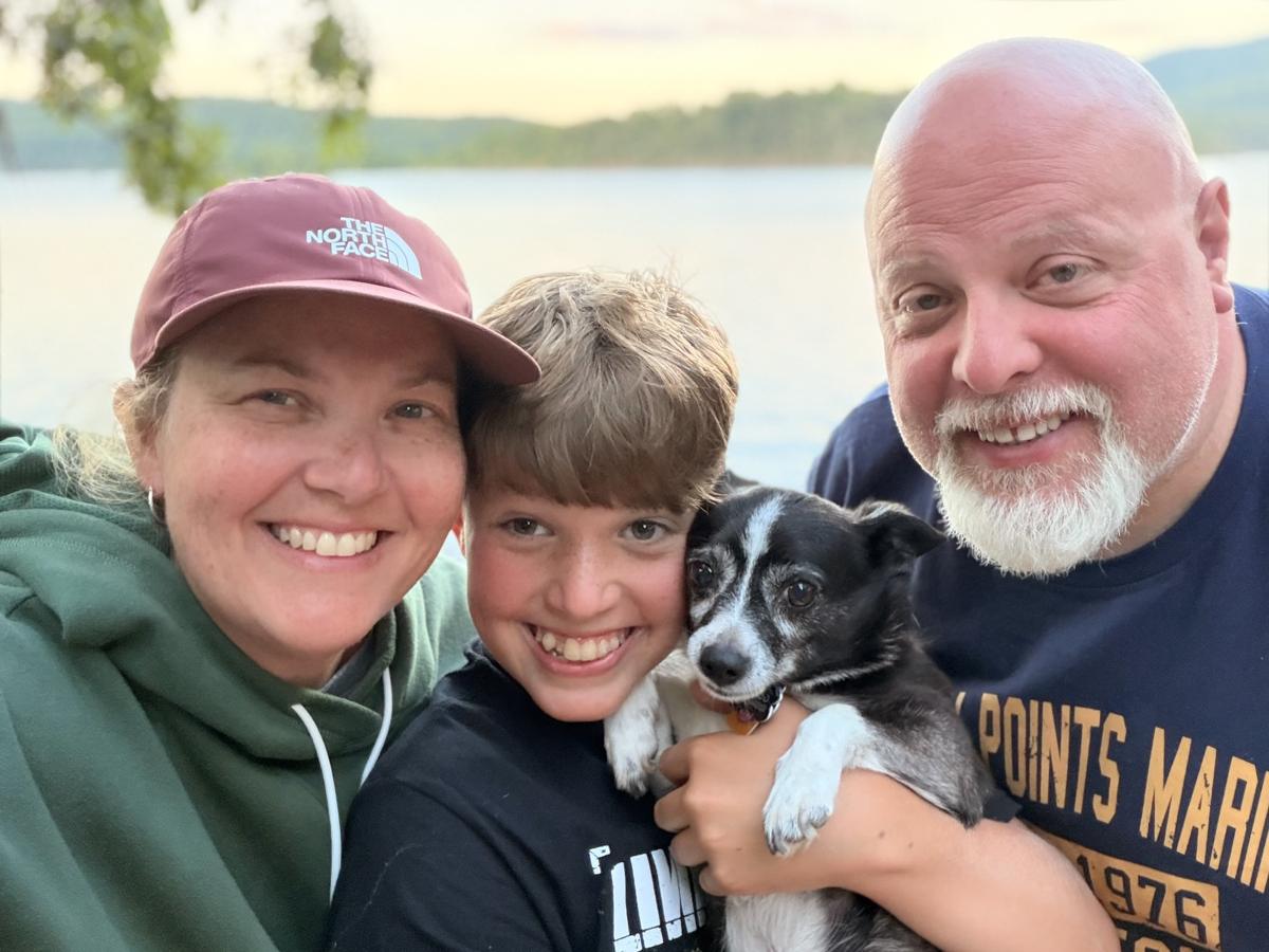 Heather, Carter, and the puppy at the lake