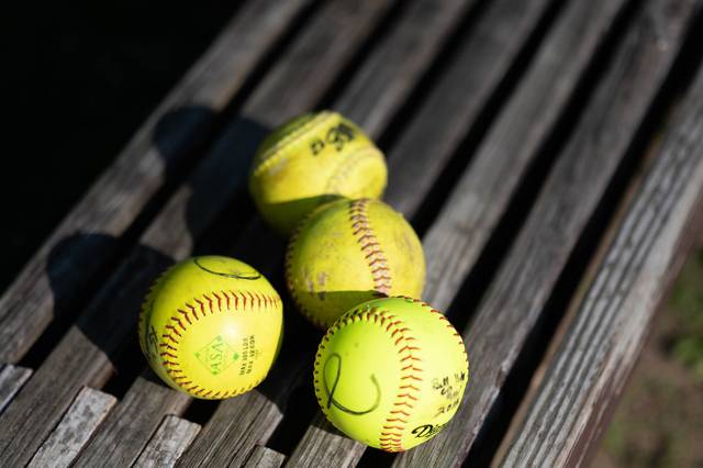 Softballs on a bench
