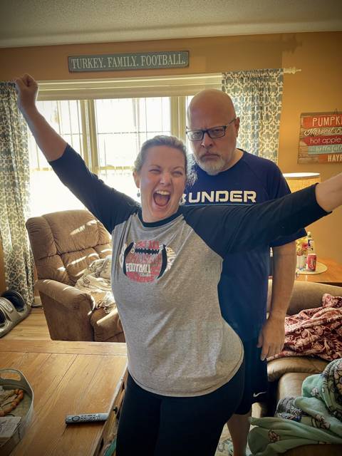 Corey and Heather cheering on the couch