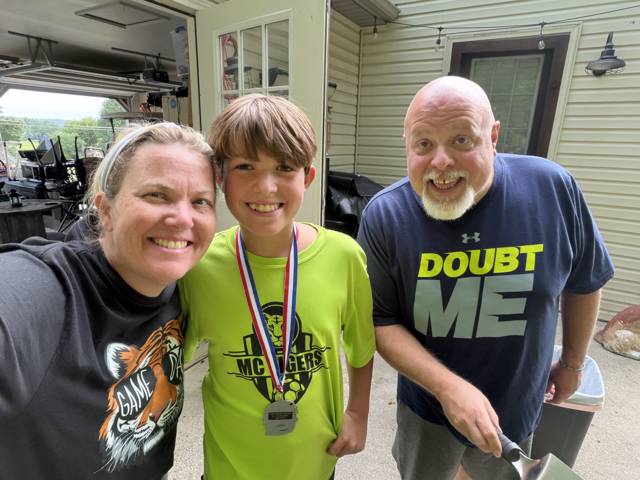 The family in the garage, medal day